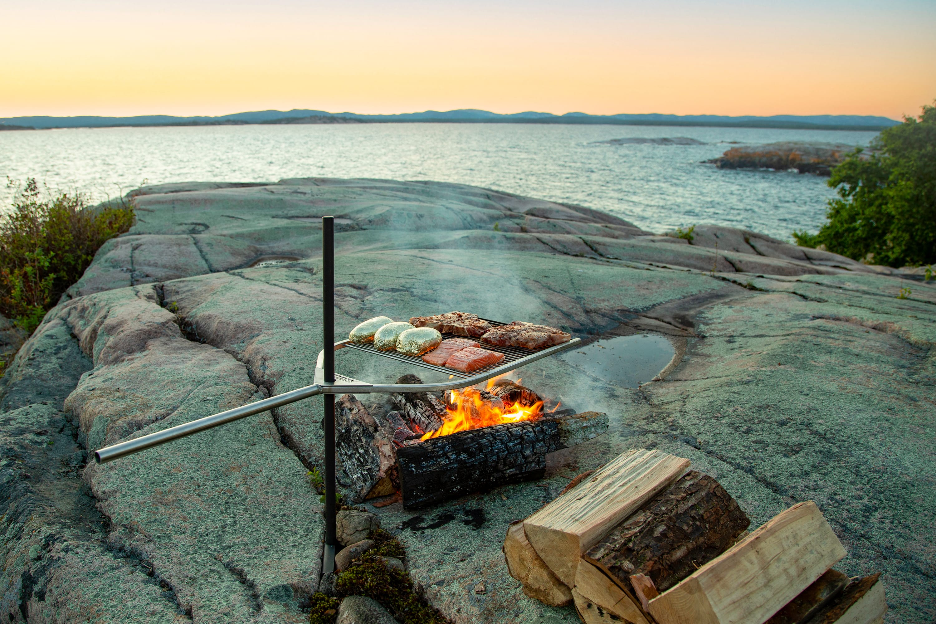Adjustable BBQ grill with ground stake