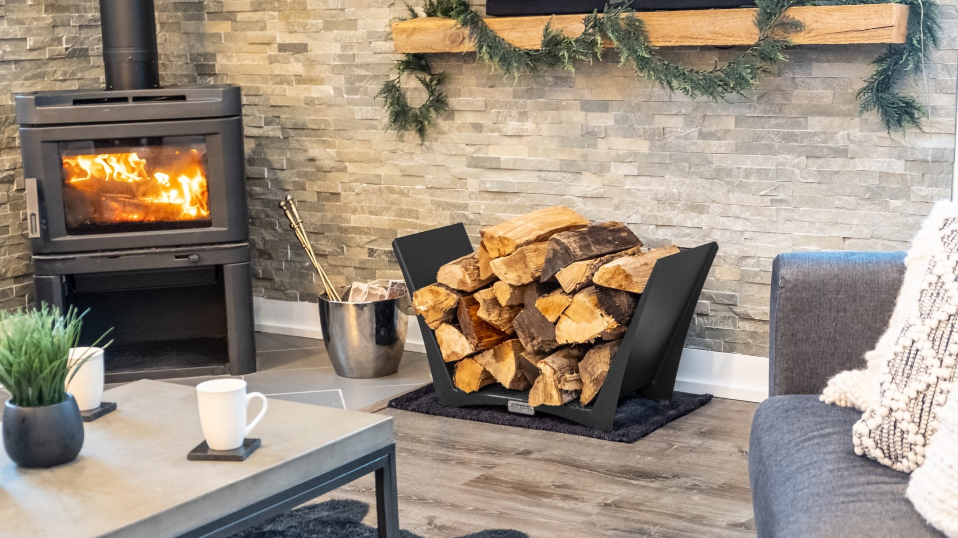 Customer standing beside a Tamarack log holder