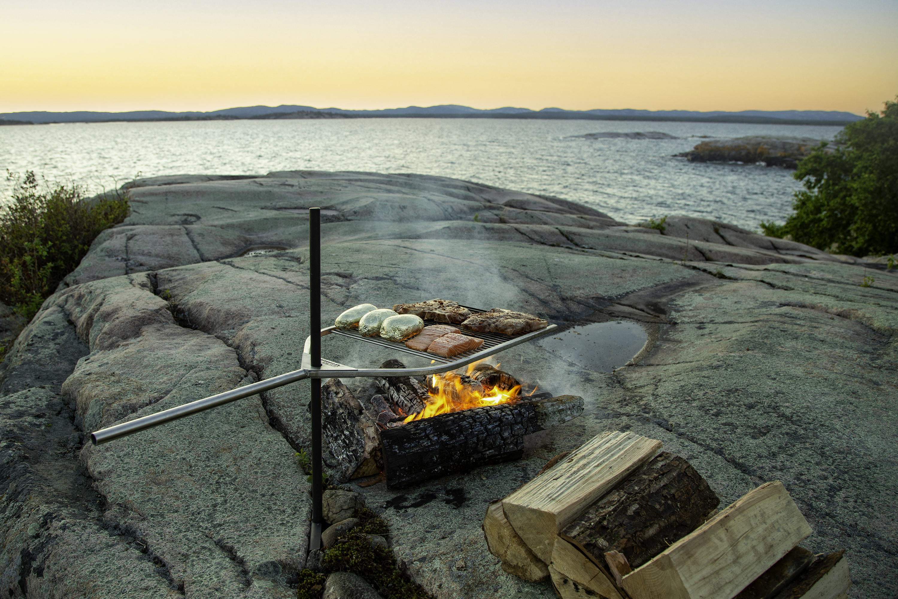 Adjustable BBQ grill with ground stake