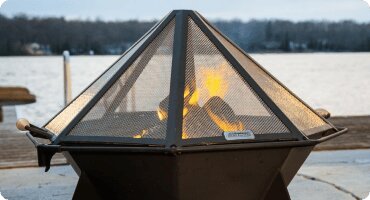 Modern Cube steel fire pit with strong geometric lines.