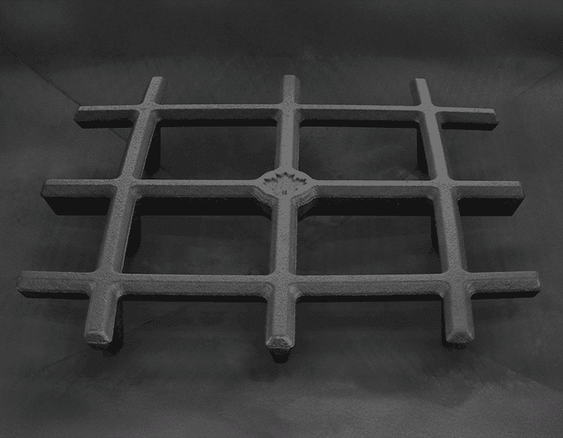 Small fire grate sitting in the floor of a Pyramid shaped fire pit