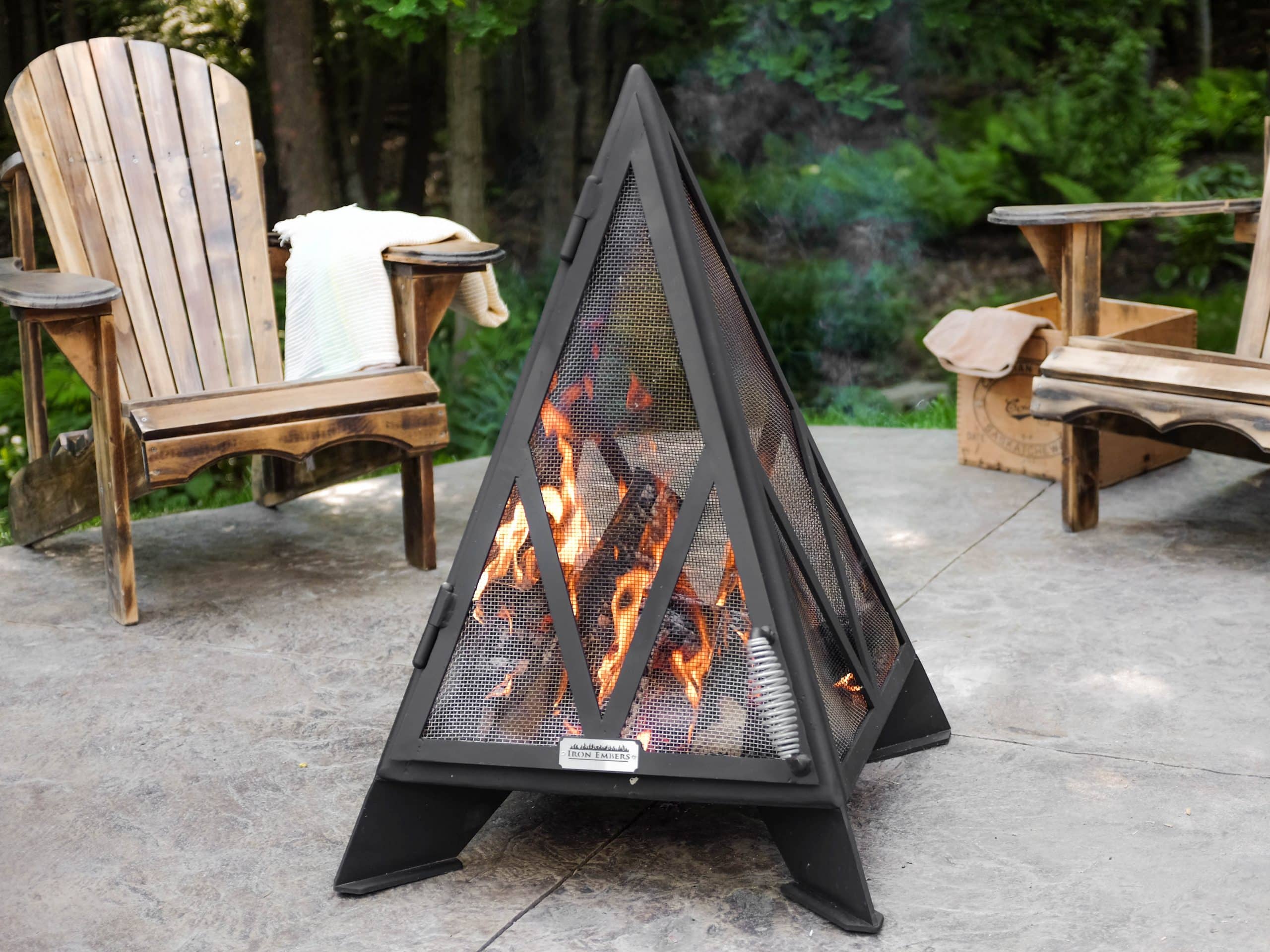 3' Pyramid Fireplace on a patio surrounded by Muskoka chairs