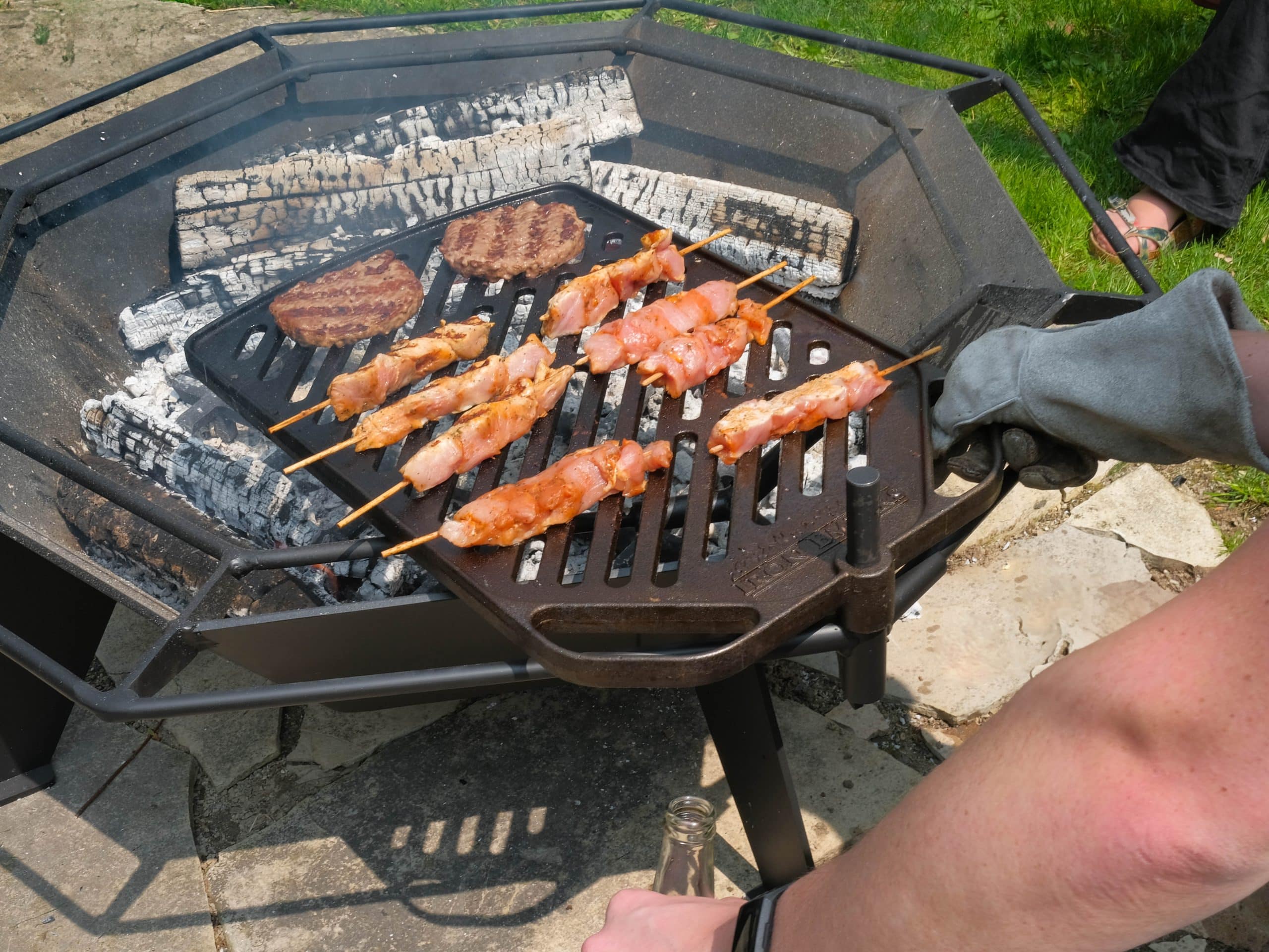 Grilling hamburgers and chicken skewers on a 3' Octagonal Cottager